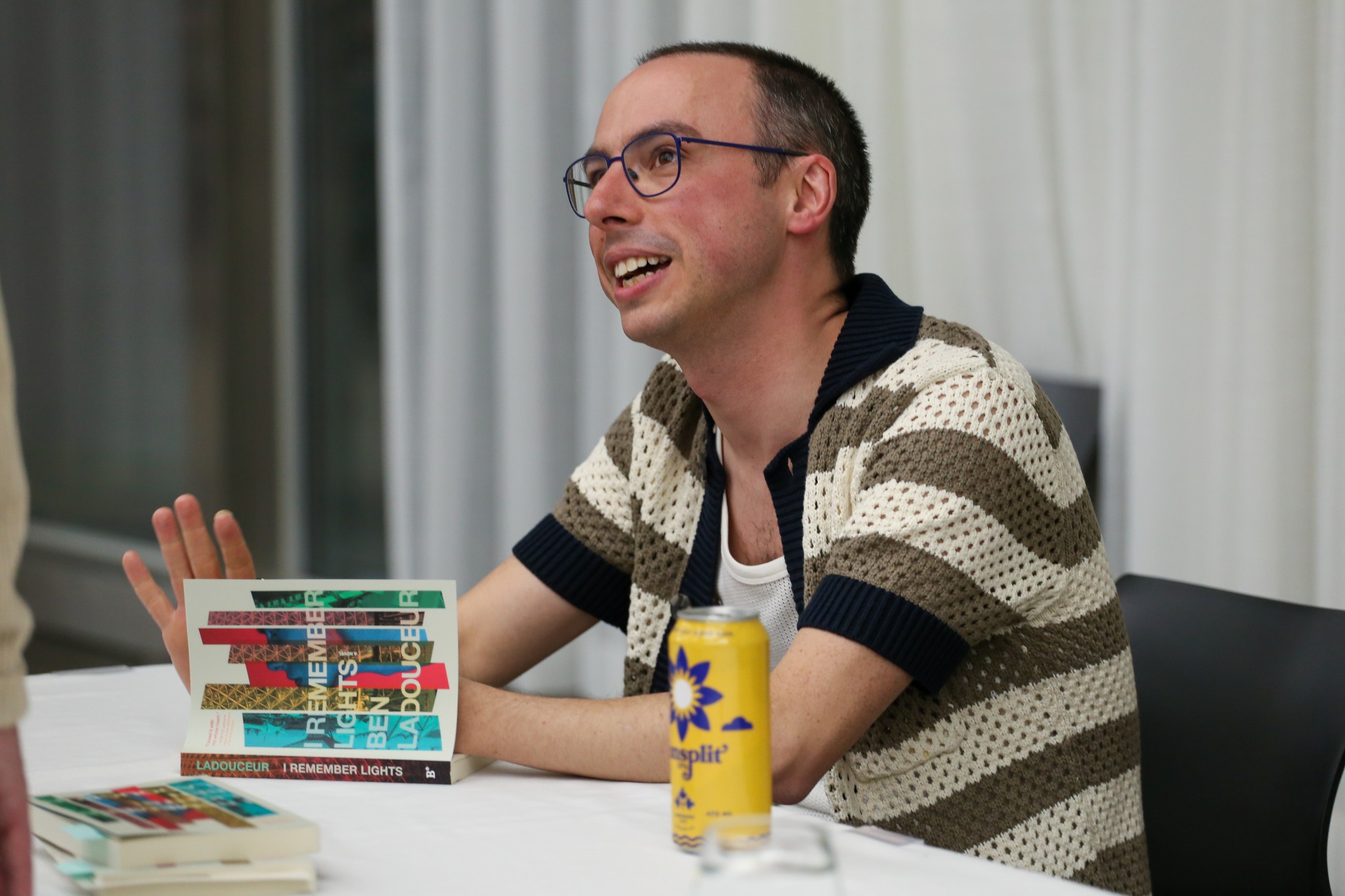 Ben Ladouceur signing a copy of his book, I Remember Lights.